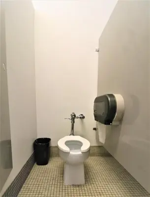 a bathroom with a toilet in a stall at The Grey Nuns Residence by Concordia University in Montréal