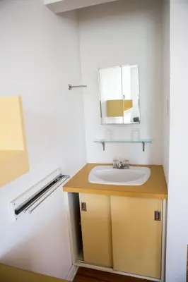 a bathroom with a sink and a mirror at The Grey Nuns Residence by Concordia University in Montréal