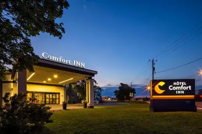 a north comfort inn sign in front of a building at Comfort Inn Montreal Aeroport in Pointe-Claire