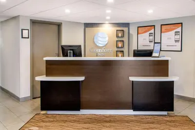 a lobby with a counter in a hospital at Comfort Inn Montreal Aeroport in Pointe-Claire