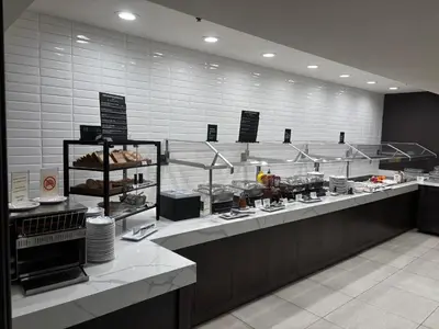 a kitchen with aasteryasteryasteryasteryasteryasteryasteryasteryasteryasteryasteryastery at Holiday Inn Montreal Centre Ville Downtown by IHG in Montréal