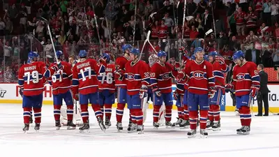 a group of hockey players standing on the ice at Holiday Inn Montreal Centre Ville Downtown by IHG in Montréal