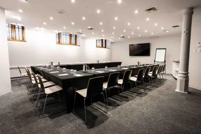 a large conference room with a long table and chairs at Hotel Gault in Montréal