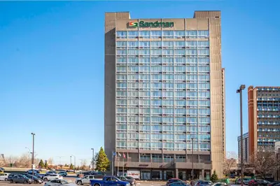 a building with a sap sign on top of it at Sandman Hotel Montreal - Longueuil in Longueuil