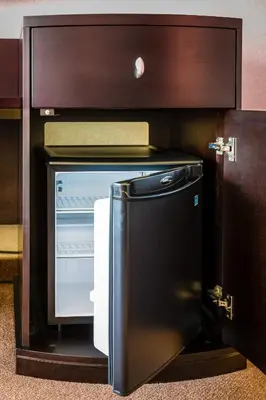 a microwave oven with its door open in a kitchen at Auberge Royal Versailles in Montréal