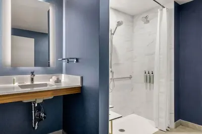 a bathroom with a sink and a shower at Residence Inn by Marriott Laval in Laval