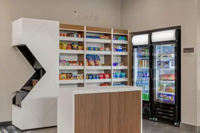 a store with a refrigerator and shelves with food at Residence Inn by Marriott Laval in Laval