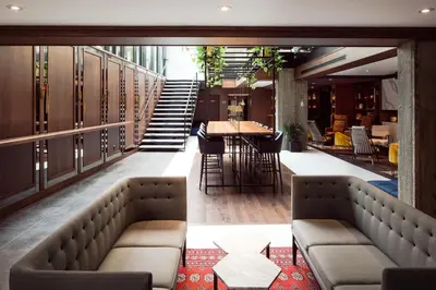 a bar with couches and a table and chairs at William Gray by Gray Collection in Montréal