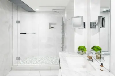 a white bathroom with a shower and a sink at William Gray by Gray Collection in Montréal