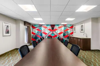 a conference room with a long table and chairs at Best Western Plus Hotel Montreal in Montréal