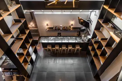 an overhead view of a restaurant with a bar at Empire Suites in Montréal