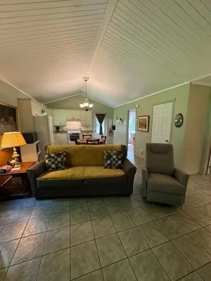 a living room with a couch and a chair at Havre De Paix in Piopolis