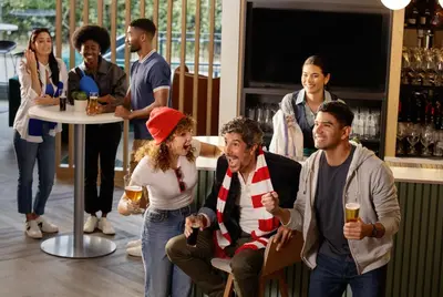 a group of people standing around a bar at Holiday Inn Hotel & Suites - Montreal Centre-ville Ouest by IHG in Montréal