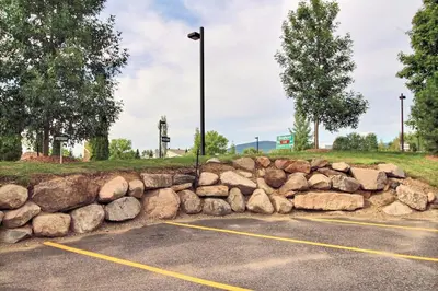 a rock retaining wall in a parking lot at Le 204 Champlain Bromont in Bromont