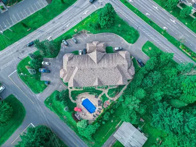 an aerial view of a house with a driveway at Le 204 Champlain Bromont in Bromont