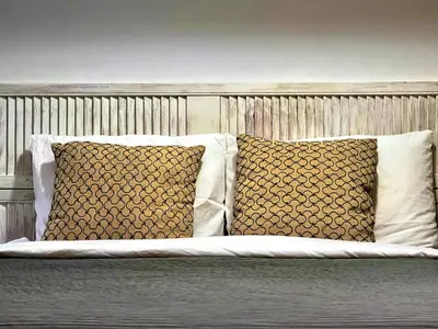 a bed with two pillows on it with two at L'Hotel Particulier Griffintown in Montréal