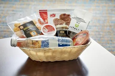 a basket of food and snacks on a table at Residence Inn by Marriott Montréal Downtown in Montréal