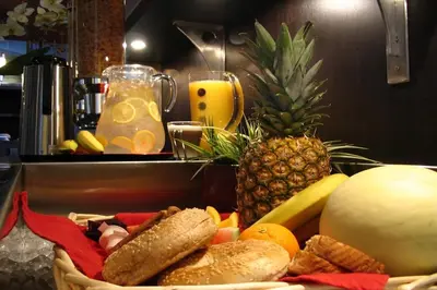 a basket of food with a pineapple and bread at Grand Hotel Times Sherbrooke in Sherbrooke
