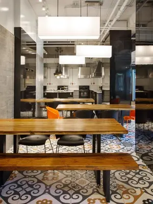 a dining room with wooden tables and chairs at ZUM MTL Auberge d'été - Université de Montréal in Montréal
