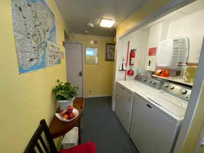 a small kitchen with a sink and a dishwasher at Martine & Michel in Boucherville