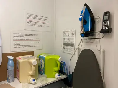 a hospital room with a phone on the wall at Martine & Michel in Boucherville