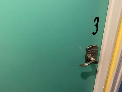 a door with a question mark on the door at Martine & Michel in Boucherville