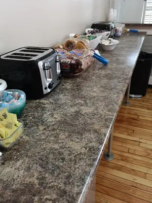 a granite counter top with a toaster on it at Hotel Quartier des Spectacles in Montréal
