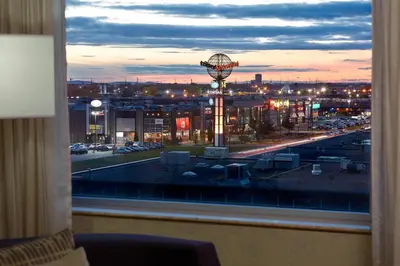 a view from a window of a city at night at Courtyard by Marriott Montreal Airport in Dorval