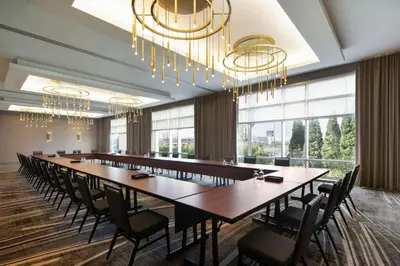 a large conference room with a long table and chairs at Courtyard by Marriott Montreal Airport in Dorval
