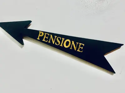 a black ribbon with the word permission written on it at Pensione Popolo in Montréal
