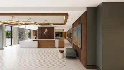 an office lobby with a reception desk and a counter at Holiday Inn St-Jean-sur-Richelieu Congrès by IHG in Saint-Jean-sur-Richelieu