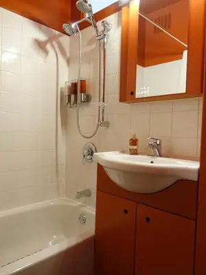 a bathroom with a sink and a bath tub at Gite à Coté in Montréal