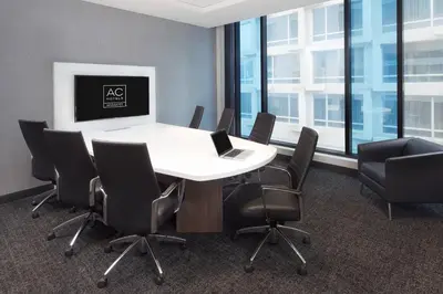 a conference room with a white table and chairs at Hôtel AC Montréal Centre-ville in Montréal