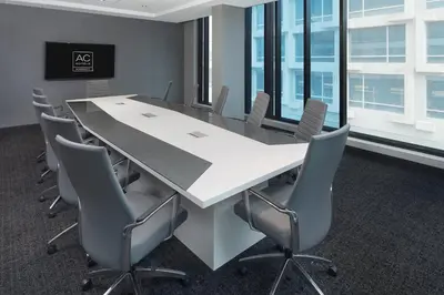 a conference room with a large white table and chairs at Hôtel AC Montréal Centre-ville in Montréal