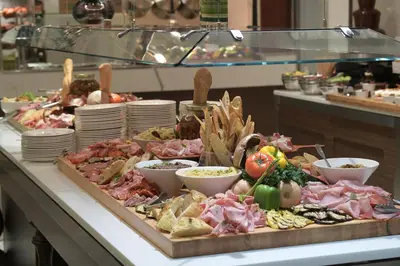 a buffet with many different types of food on a table at Sheraton Laval Hotel in Laval