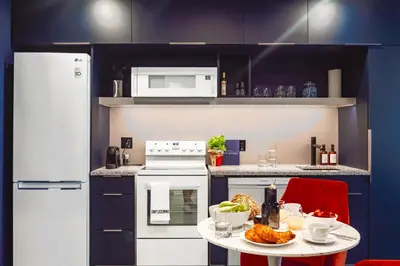 a kitchen with a table with food on it at Pierce Boutique Apartments by Simplissimmo in Montréal
