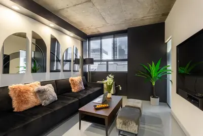 a living room with a couch and a table at Pierce Boutique Apartments by Simplissimmo in Montréal