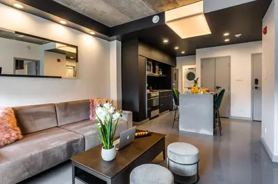a living room with a couch and a table at Pierce Boutique Apartments by Simplissimmo in Montréal