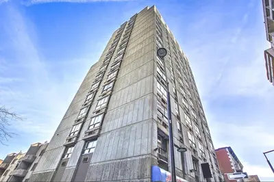 a tall building on a city street at Pierce Boutique Apartments by Simplissimmo in Montréal
