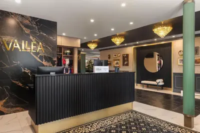 a lobby of a valeline store with a reception desk at Hotel Vallea Bromont, Tapestry Collection by Hilton in Bromont