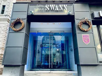 a building with two wreaths on the front of it at Hotel Chez Swann in Montréal