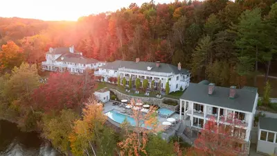an aerial view of a house in the forest at Manoir Hovey, Relais & Châteaux in North Hatley