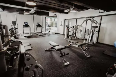 a gym with several treadmills and cardio machines at DoubleTree By Hilton Montreal in Montréal