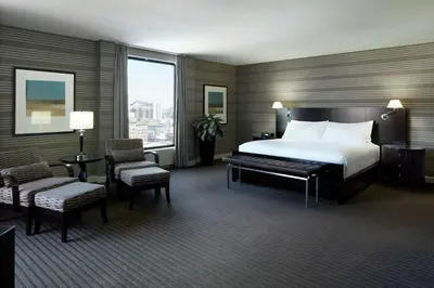 a hotel room with a bed and a large window at DoubleTree By Hilton Montreal in Montréal