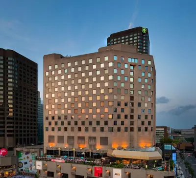 a tall building with a clock on top of it at DoubleTree By Hilton Montreal in Montréal
