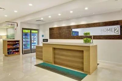 a lobby of a home store with a counter at Home2 Suites By Hilton Montreal Dorval in Dorval