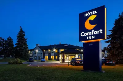 a sign in front of a hotel comfort inn at Comfort Inn Aeroport in Dorval