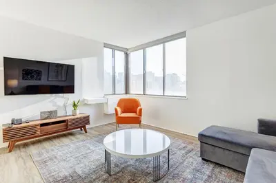 a living room with a couch and a coffee table at LaCité Cozy Apartment Close to Central Montreal in Montréal