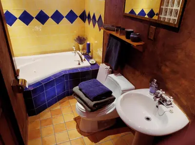 a bathroom with a toilet and a tub and a sink at A La Carte Bed & Breakfast in Montréal