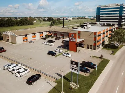 an aerial view of a parking lot in front of a building at Le Dauphin St-Hyacinthe in Saint-Hyacinthe